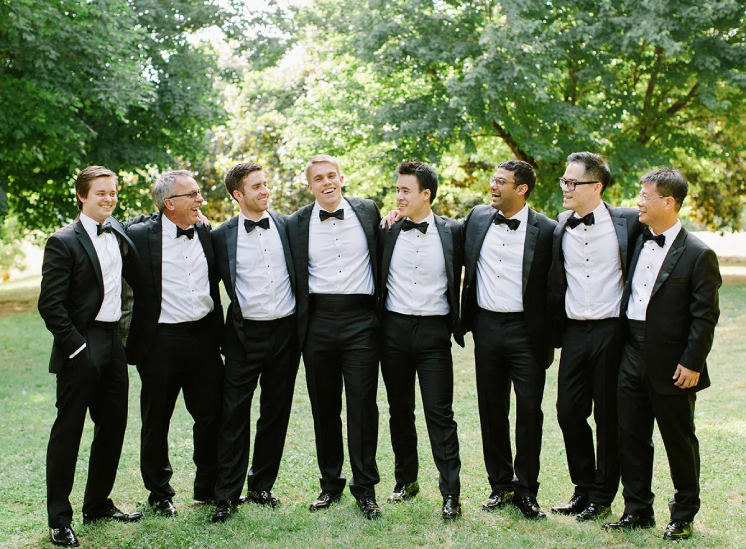 Photo of the groom and bestmans wearing tuxedos